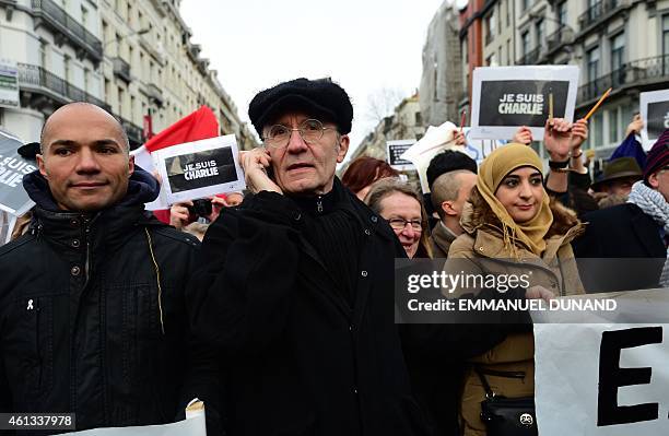 Belgium cartoonist Philippe Geluck marches with some 20,000 people on January 11, 2015 in Brussels in tribute to the 17 victims of the three-day...