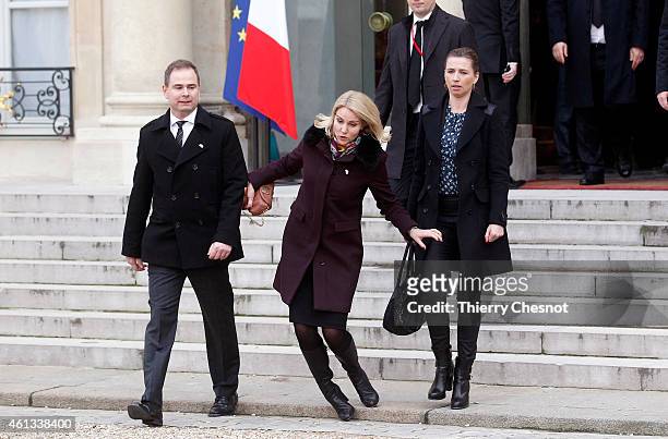 Danish Prime Minister Helle Thorning-Schmidt falls down as she leaves the Elysee Palace after attending a Unity rally on January 11, 2015 in Paris,...