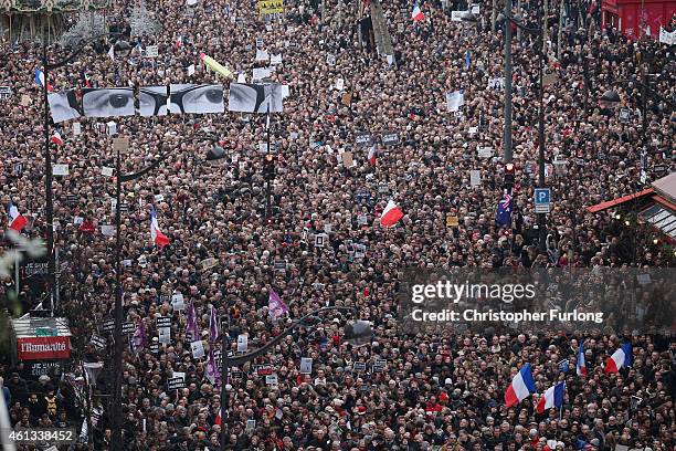 Demonstrators make their way along Boulevard Voltaire in a unity rally in Paris following the recent terrorist attacks on January 11, 2015 in Paris,...