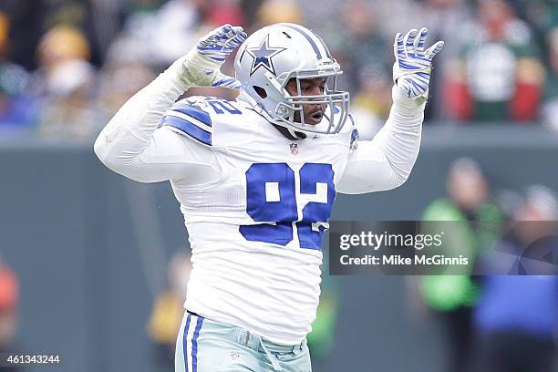 Jeremy Mincey of the Dallas Cowboys reacts after sacking quarterback Aaron Rodgers of the Green Bay Packers during the 2015 NFC Divisional Playoff...