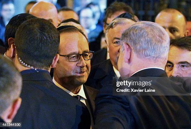 French President Francois Hollande and Israel Prime Minister Benjamin Netanyahu visit the Paris Grand Synagogue after mass unity rally following the...