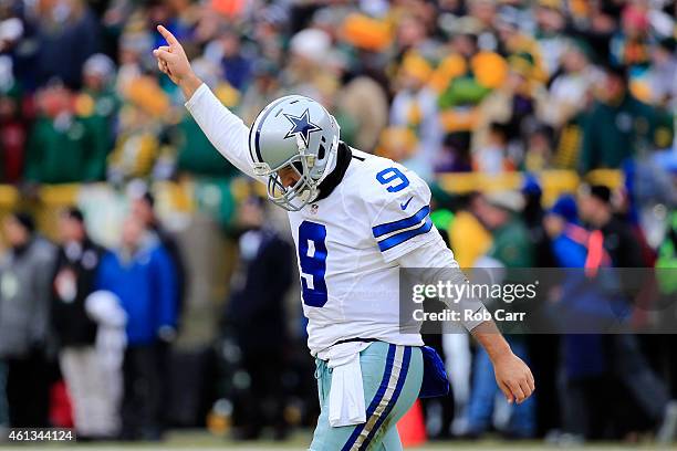 Quarterback Tony Romo of the Dallas Cowboys reacts after the Cowboys scored against the Green Bay Packers in the second qaurter of the 2015 NFC...