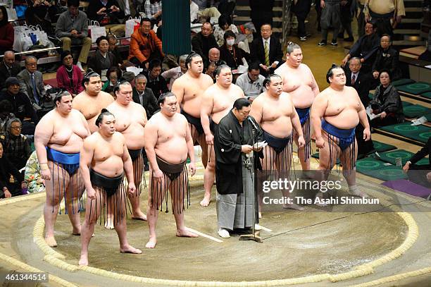 The Japan Sumo Association President Kitanoumi addresses while yokozuna, ozeki, sekiwake ranked wrestlers line up to listen prior to the 'Makuuchi'...