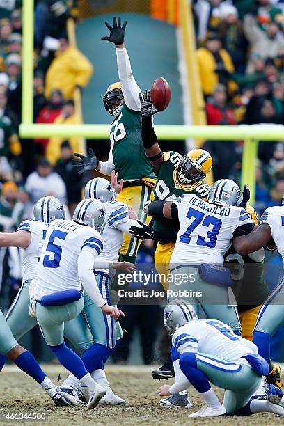 Datone Jones of the Green Bay Packers tips the football on a Dallas Cowboys field goal during the 2015 NFC Divisional Playoff game at Lambeau Field...