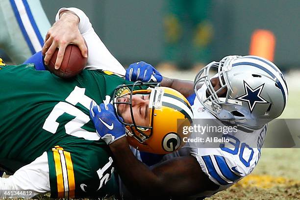 Demarcus Lawrence of the Dallas Cowboys sacks quarterback Aaron Rodgers of the Green Bay Packers in the second quarter of the 2015 NFC Divisional...