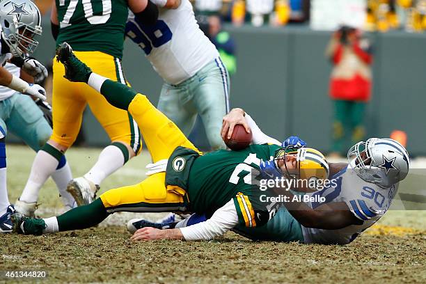 Demarcus Lawrence of the Dallas Cowboys sacks quarterback Aaron Rodgers of the Green Bay Packers in the second quarter of the 2015 NFC Divisional...