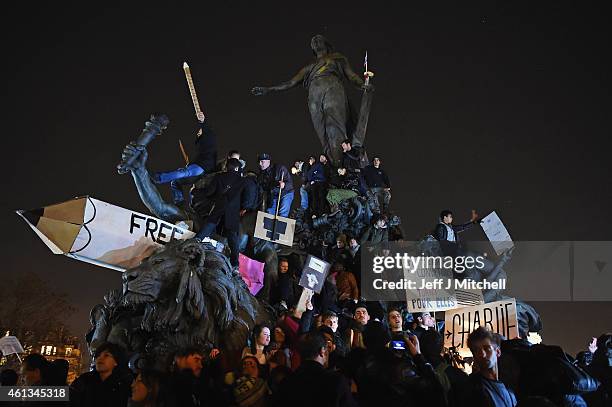 People gather at Place de la Nation, following a mass unity rally following thousands of people marching from Place de la Republique on route to...