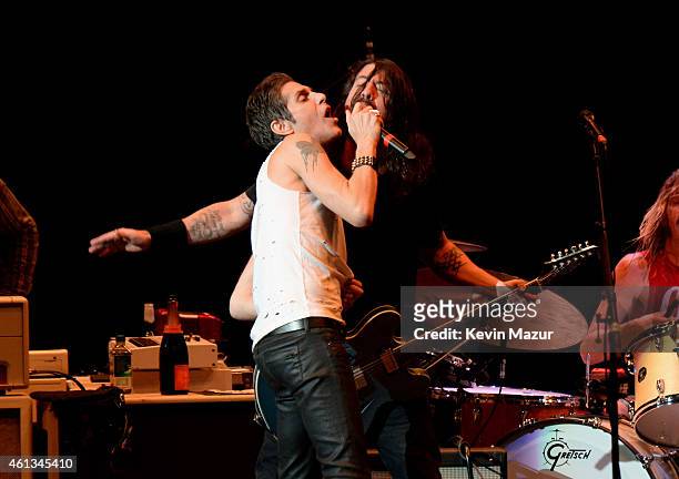 Perry Farrell and Dave Grohl perform onstage during Dave Grohl's birthday bash at The Forum on January 10, 2015 in Inglewood, California.
