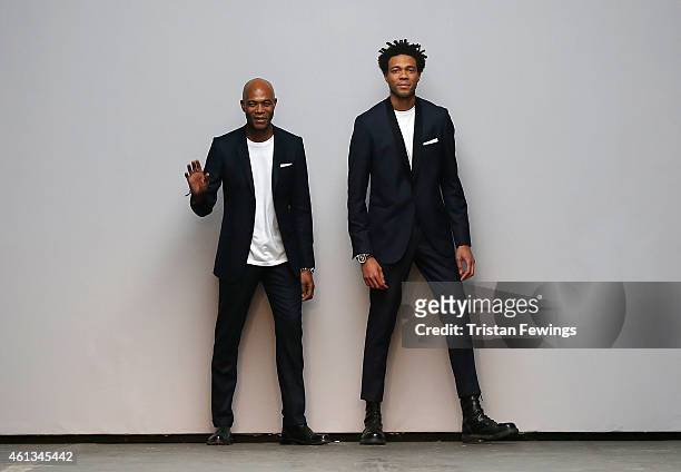 Designers father and son Joe and Charlie Casely-Hayford acknowledge the audience during the Casely-Hayford show at the London Collections: Men AW15...