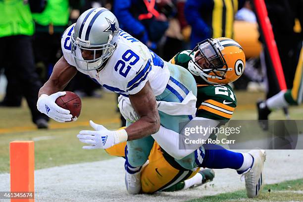 DeMarco Murray of the Dallas Cowboys scores a touchdown in the third quarter against Ha Ha Clinton-Dix of the Green Bay Packers during the 2015 NFC...