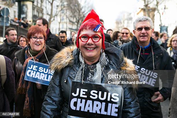 Demonstrators make their way along 'Place de la Republique' in a unity rally in Paris following the recent terrorist attacks on January 11, 2015 in...