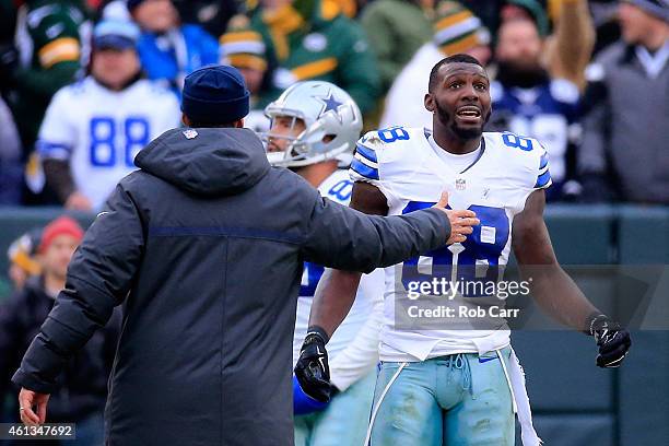 Dez Bryant of the Dallas Cowboys waits for a replay on a call late in the fourth quarter against the Green Bay Packers during the 2015 NFC Divisional...