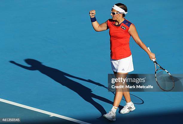 Kirsten Flipkens of Belguim celebrates winning match point in her second round match against Storm Sanders of Australia during day four of the...