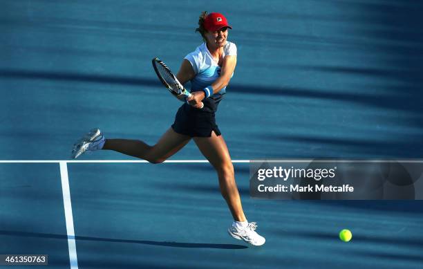 Monica Niculescu of Romania hits a backhand in her second round match against Mona Barthel of Germany during day four of the Moorilla Hobart...