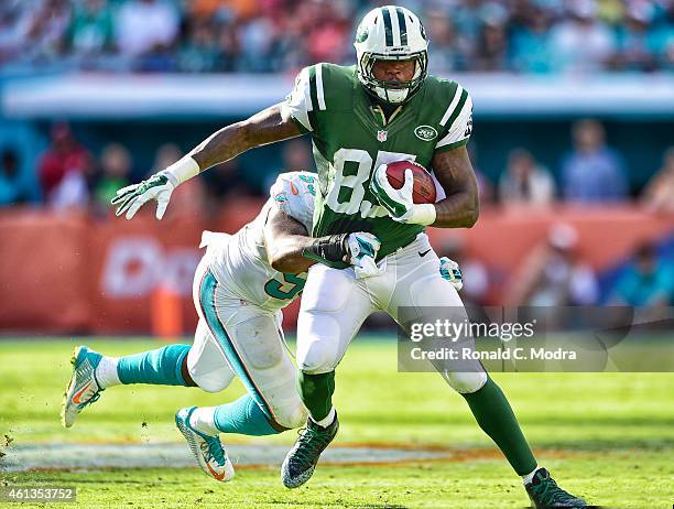 Tight end Jeff Cumberland of the New York Jets carries the ball during a game against the Miami Dolphins at Sun Life Stadium on December 28, 2014 in...