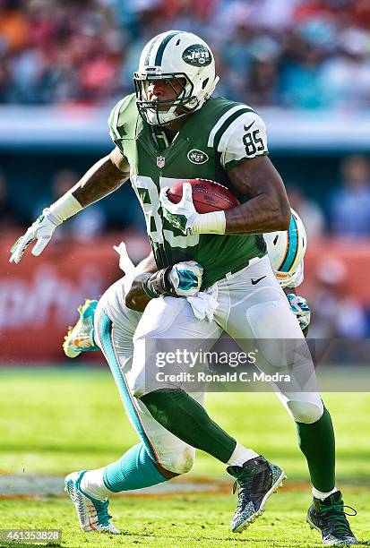 Tight end Jeff Cumberland of the New York Jets carries the ball during a game against the Miami Dolphins at Sun Life Stadium on December 28, 2014 in...