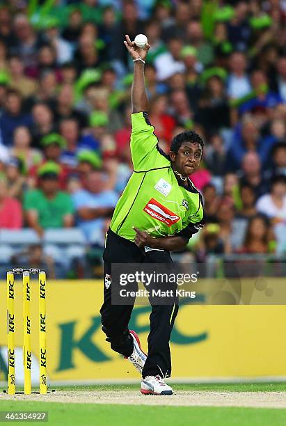Ajantha Mendis of the Thunder bowls during the Big Bash League match between Sydney Thunder and Brisbane Heat at ANZ Stadium on January 8, 2014 in...