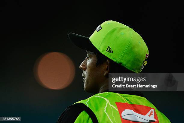 Ajantha Mendis of the Thunder looks on during the Big Bash League match between Sydney Thunder and Brisbane Heat at ANZ Stadium on January 8, 2014 in...
