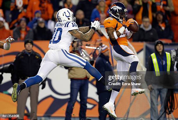 Rahim Moore of the Denver Broncos intercepts a pass intended for Donte Moncrief of the Indianapolis Colts during a 2015 AFC Divisional Playoff game...