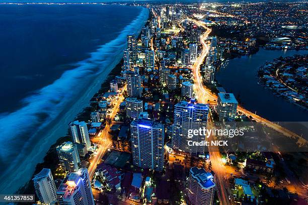 aerial view of gold coast at night, australia - gold coast australia fotografías e imágenes de stock
