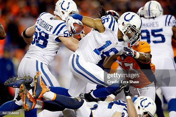 Josh Cribbs of the Indianapolis Colts runs through traffic on a kickoff return against the Denver Broncos during a 2015 AFC Divisional Playoff game...