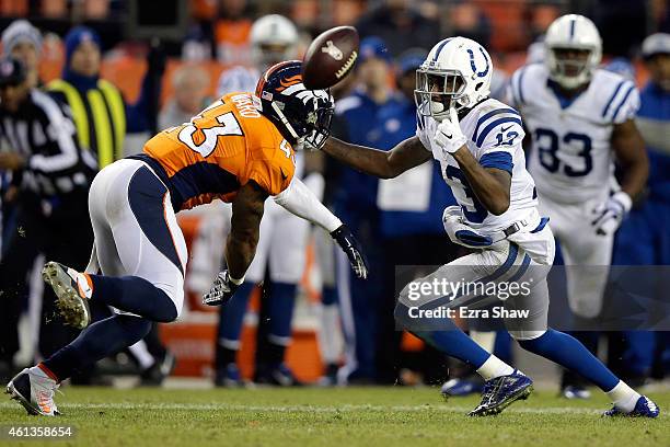 Hilton of the Indianapolis Colts tries to make a catch as T.J. Ward of the Denver Broncos defends during a 2015 AFC Divisional Playoff game at Sports...