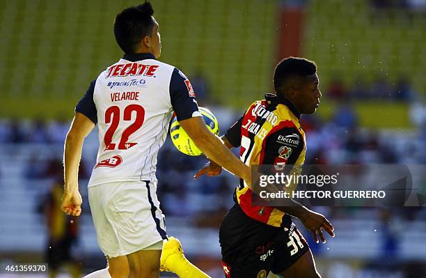 Jonathan Gonzales of Leones Negros vies for the ball with Efrain Velarde of Monterrey, during their Mexican Clausura 2015 tournament football match...