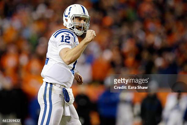 Andrew Luck of the Indianapolis Colts pumps his fist to celebrate a play against the Denver Broncos during a 2015 AFC Divisional Playoff game at...
