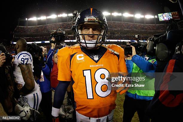 Peyton Manning of the Denver Broncos walks off the field after losing 24-13 to the Indianapolis Colts in a 2015 AFC Divisional Playoff game at Sports...