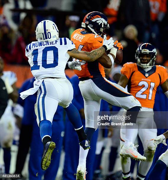 Rahim Moore of the Denver Broncos intercepts the ball agains Donte Moncrief of the Indianapolis Colts in the third quarter. The Denver Broncos played...