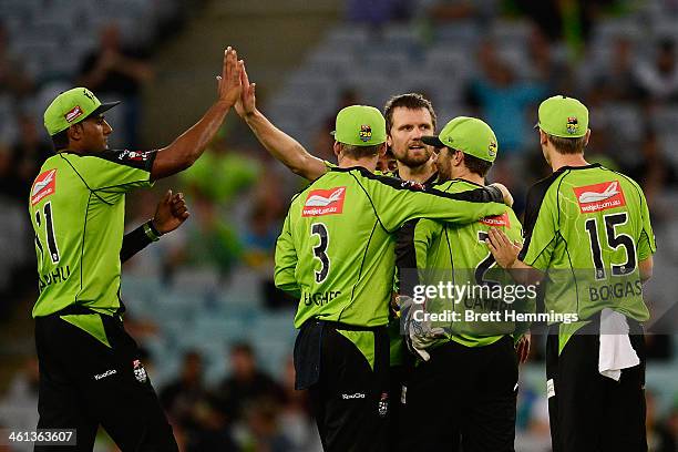 Dirk Nannes of the Thunder celebrates after taking the wicket of Chris Lynn of the Heat during the Big Bash League match between Sydney Thunder and...