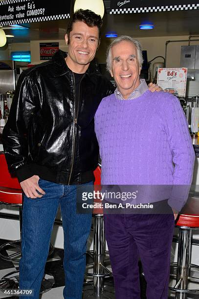 Ben Freeman and Henry Winkler attend a photocall for new musical "Happy Days" at Ed's Easy Diner on January 8, 2014 in London, England.