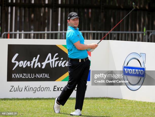 Branden Grace of South Africa conducts a Junior Clinic on the driving range during the pro-am as a preview for the 2014 Volvo Golf Champions...