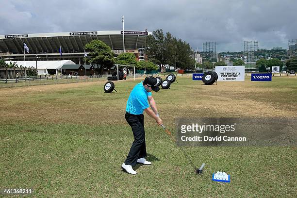 Branden Grace of South Africa conducts a Junior Clinic on the driving range during the pro-am as a preview for the 2014 Volvo Golf Champions...