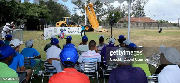 Branden Grace of South Africa conducts a Junior Clinic on the driving range during the pro-am as a preview for the 2014 Volvo Golf Champions...