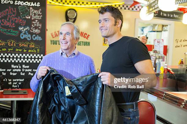 Henry Winkler and Ben Freeman attend a photocall for new musical "Happy Days" at Ed's Easy Diner on January 8, 2014 in London, England.