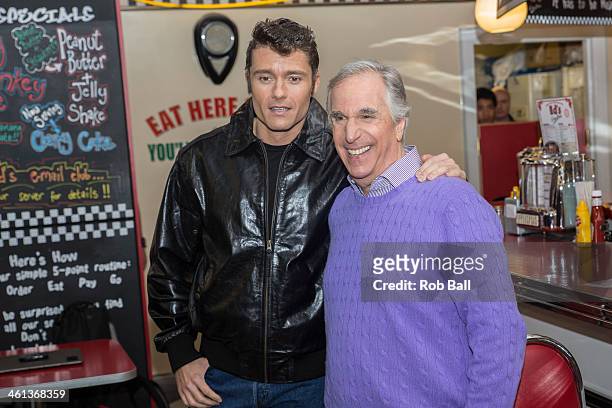 Ben Freeman and Henry Winkler attend a photocall for new musical "Happy Days" at Ed's Easy Diner on January 8, 2014 in London, England.