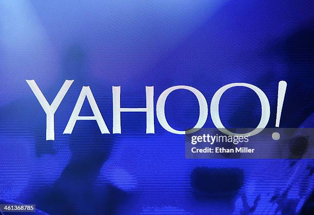 Yahoo! logo is shown on a screen during a keynote address by Yahoo! President and CEO Marissa Mayer at the 2014 International CES at The Las Vegas...