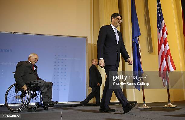 German Finance Minister Wolfgang Schaeuble and U.S. Treasury Secretary Jack Lew arrive to speak to the media following talks at the Finance Ministry...