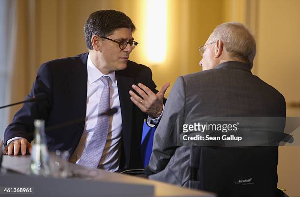 German Finance Minister Wolfgang Schaeuble and U.S. Treasury Secretary Jack Lew chat after speaking to the media following talks at the Finance...
