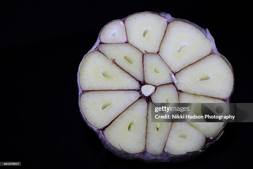 Garlic bulb cut in half inside cross section