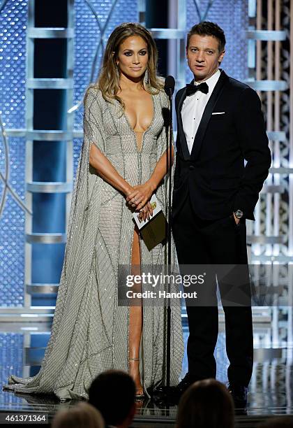 In this handout photo provided by NBCUniversal, Presenters Jennifer Lopez and Jeremy Renner speaks onstage during the 72nd Annual Golden Globe Awards...