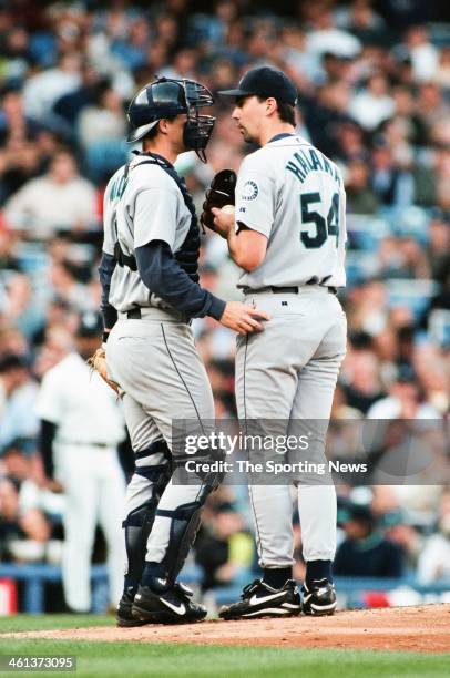 Dan Wilson and Arthur Rhodes of the Seattle Mariners talk on the mound during Game Two of the American League Championship Series against the New...