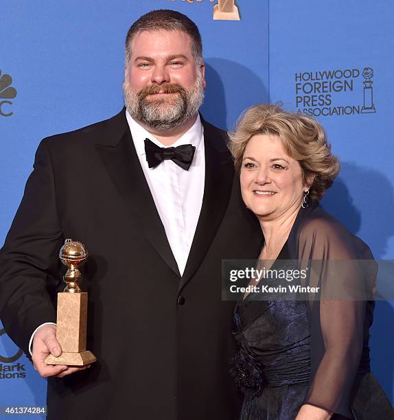 Writer/director Dean DeBlois and producer Bonnie Arnold, winners of Best Animated Feature Film for 'How to Train Your Dragon 2,' pose in the press...