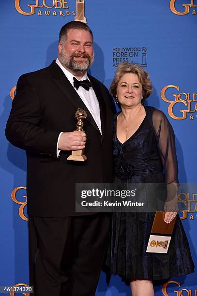 Writer/director Dean DeBlois and producer Bonnie Arnold, winners of Best Animated Feature Film for 'How to Train Your Dragon 2,' pose in the press...