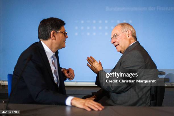 German Finance Minister Wolfgang Schaeuble and U.S. Treasury Secretary Jack Lew shake hands following talks at the Finance Ministry on January 8,...