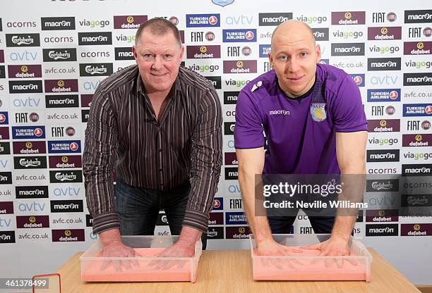 Former Aston Villa goalkeeper Nigel Spink and Aston Villa goalkeeper Brad Guzan have moulds of their hands made for the Aston Villa Heritage Zone at...