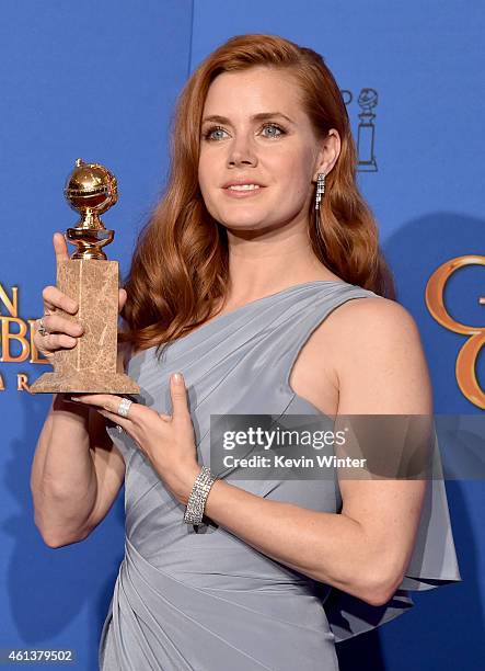 Actress Amy Adams, winner of Best Actress in a Motion Picture - Musical or Comedy for 'Big Eyes,' poses in the press room during the 72nd Annual...