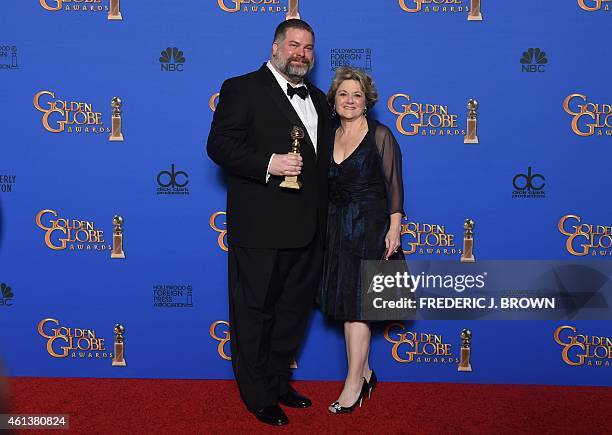 Producer Bonnie Arnold and Writer/Director Dean DeBlois pose with the award for Best Animated Feature Film for "How To Train Your Dragon 2", in the...