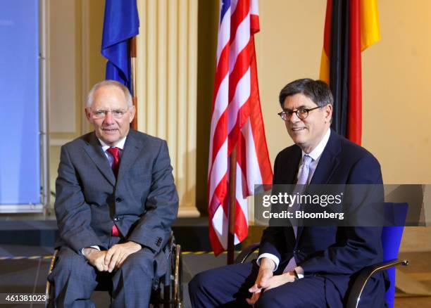 Jacob "Jack" Lew, U.S. Treasury secretary, right, poses for a photograph with Wolfgang Schaeuble, Germany's finance minister, during a news...